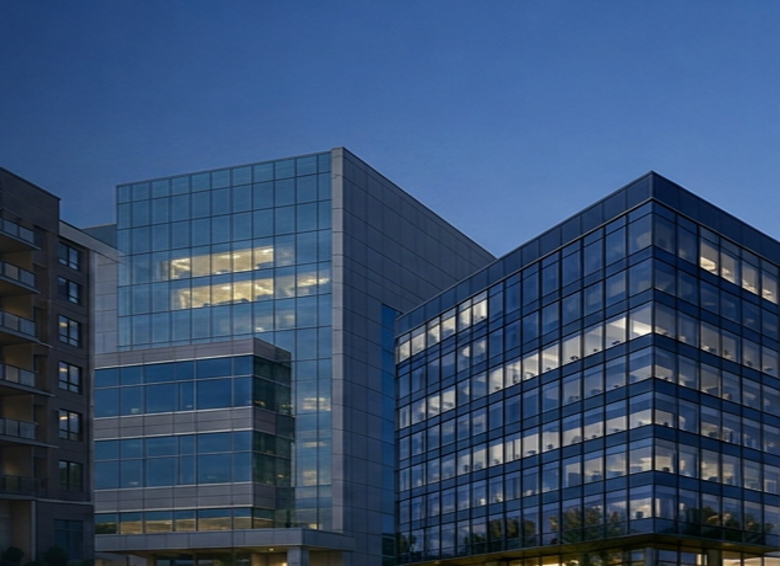 Modern glass highrise office towers at dusk in the DC metro area